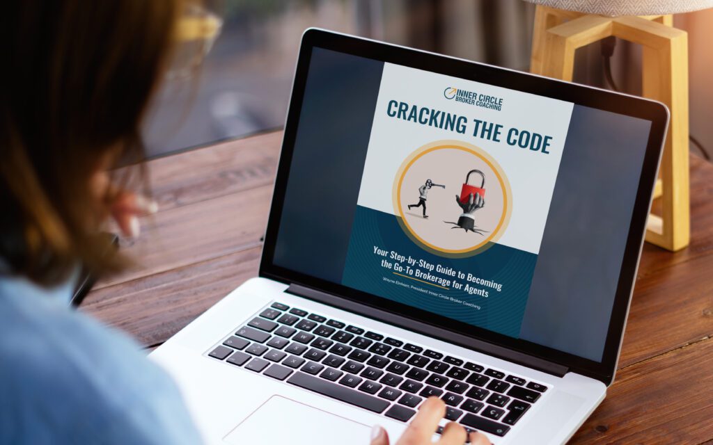 Cracking the Code guide on laptop screen.