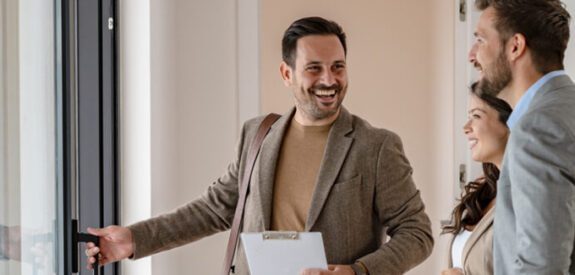 realtor giving a tour to a couple