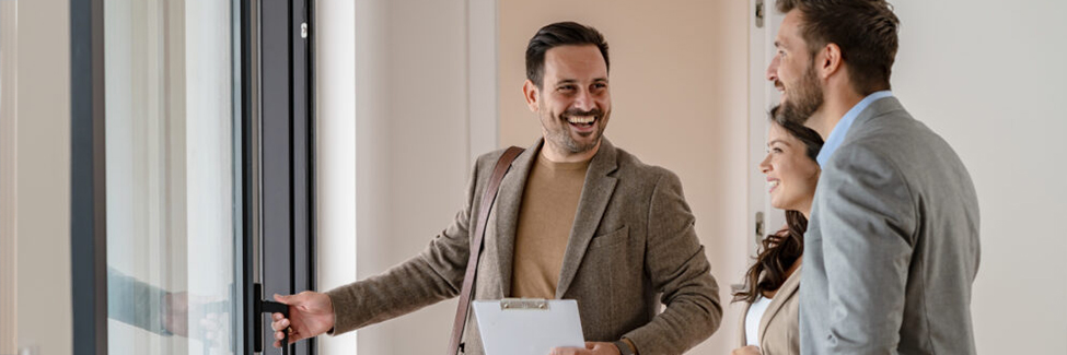 realtor giving a tour to a couple