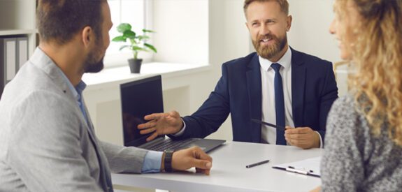 a couple attending a meeting in an office