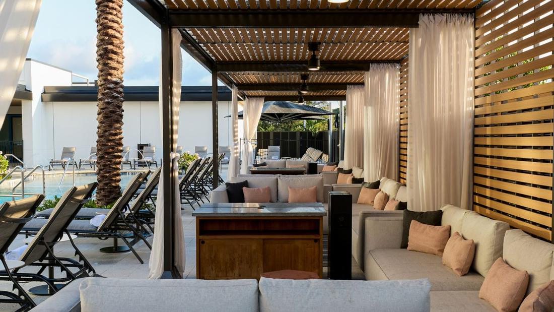 Poolside cabanas and lounge seating