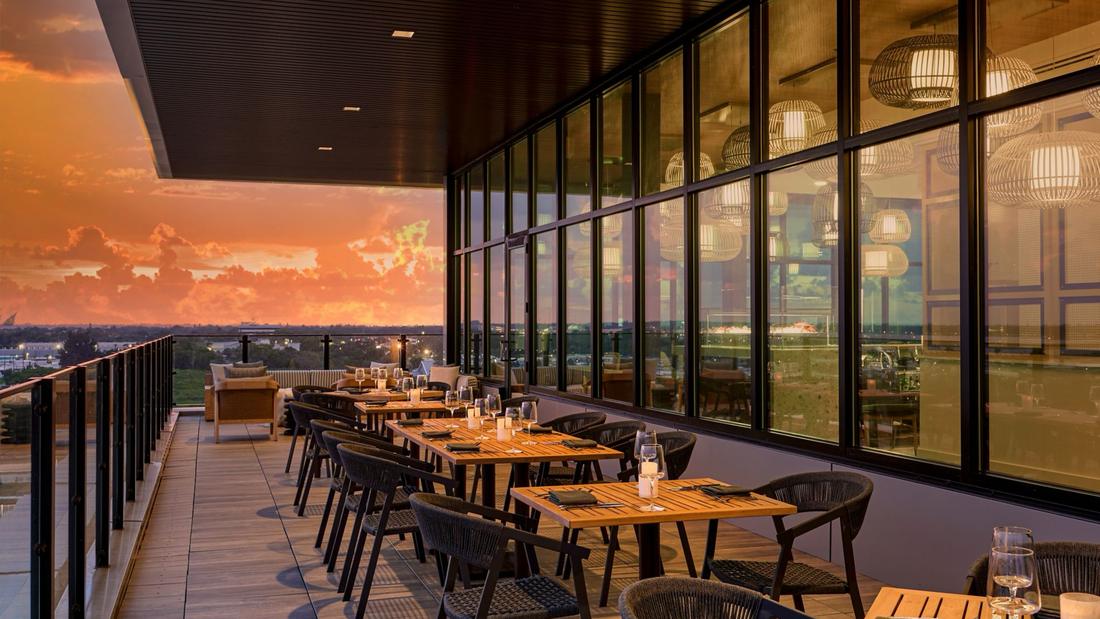 The rooftop restaurant terrace at sunset