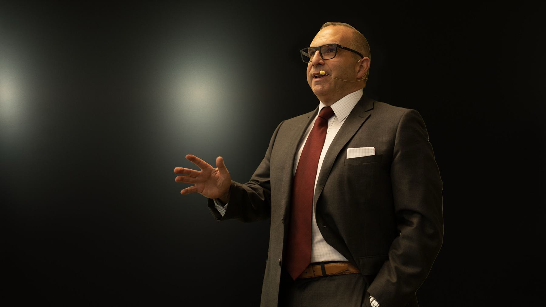 Wayne Einhorn speaking on stage at a previous ICBC event